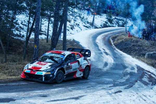 A rally car drifting in snow