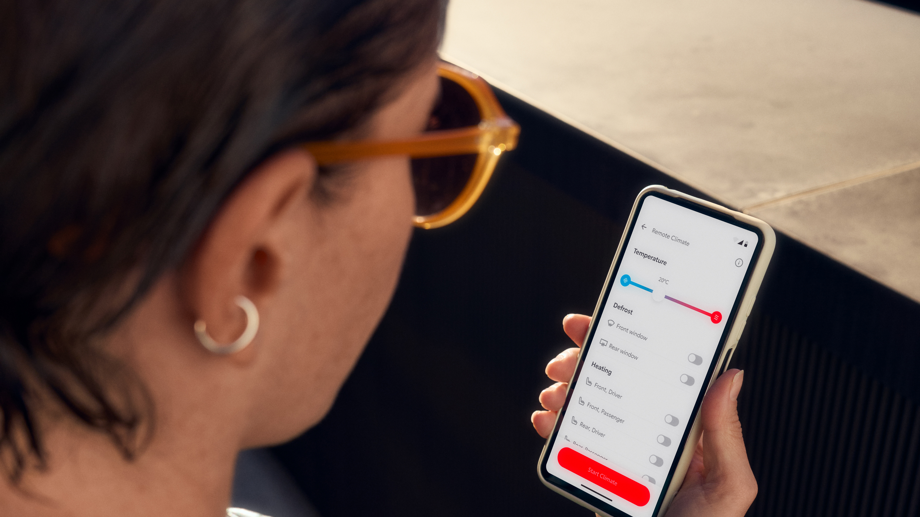 Customer using their MyToyota app on her phone.