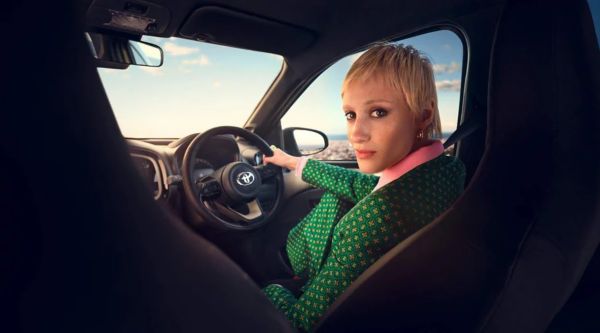 Female on the driver seat of a Toyota Aygo X