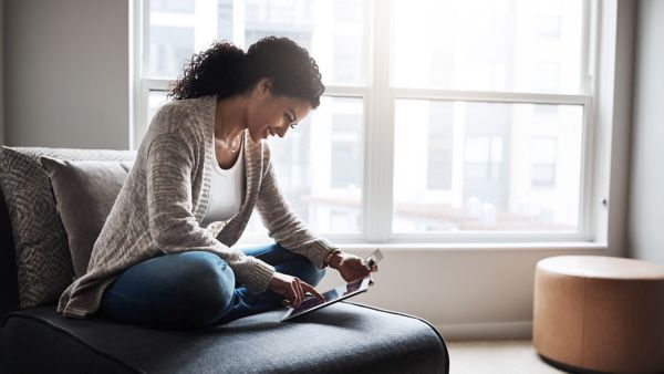 Woman on an iPad for buy online Toyota