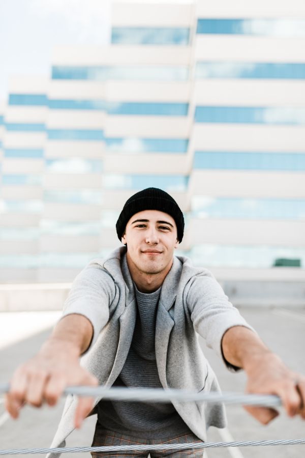 Young man with black hat and hoodie