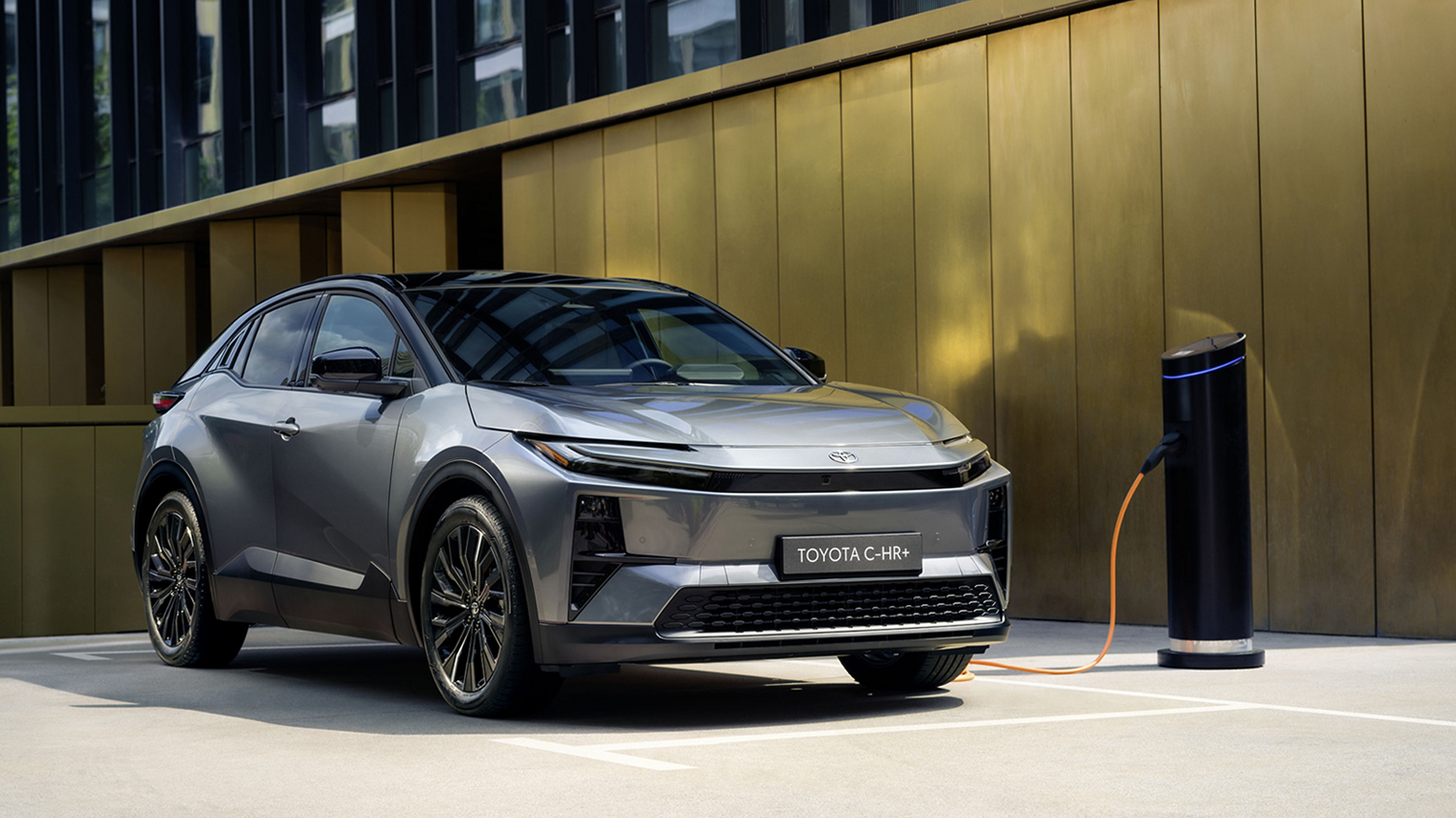 An owner charges a Toyota C-HR Plug-in Hybrid at home 