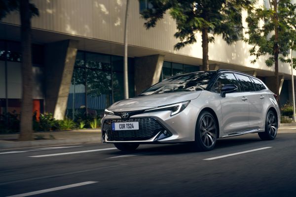 Toyota Corolla Touring Sports driving down a road