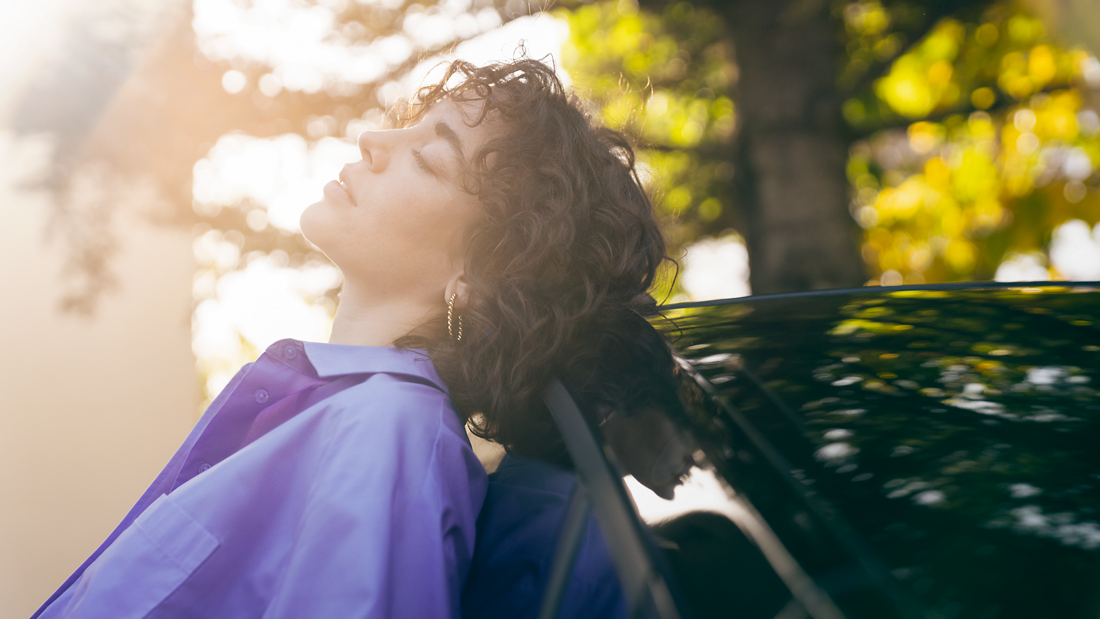 A Toyota owner relaxes in the sunshine 