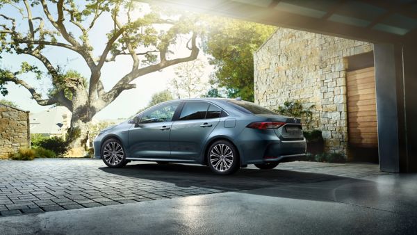 Toyota Corolla Saloon parked in a driveway