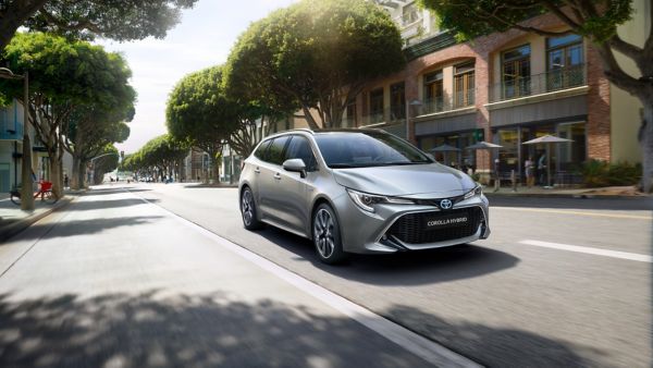 Toyota Corolla Touring Sports driving down a road