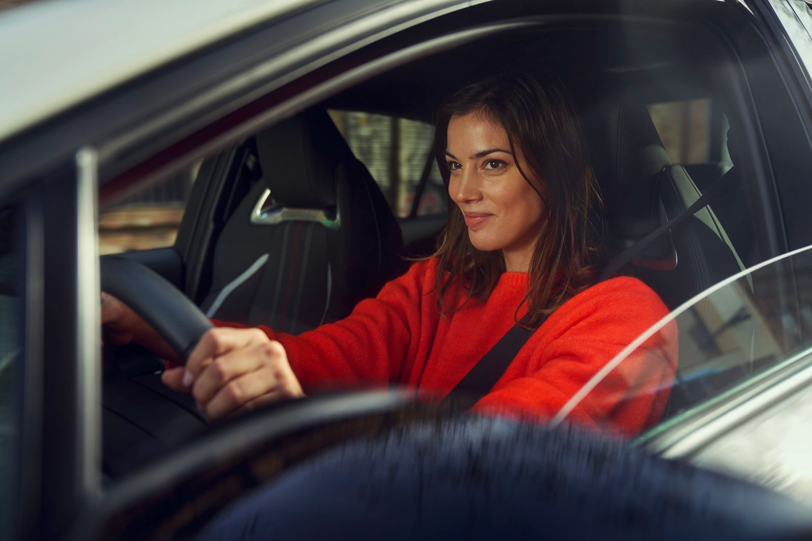 An owner behind the wheel of their Toyota Corolla Sedan