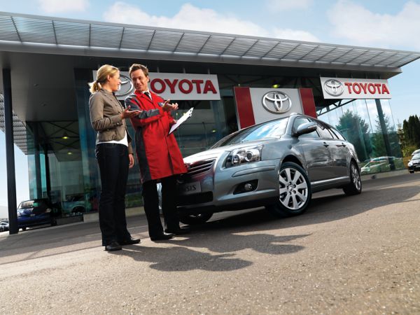 Toyota employee helping a customer