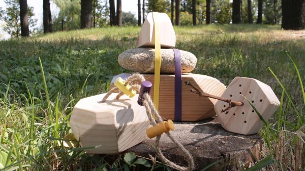 A stack of wood and stone in a woodland area