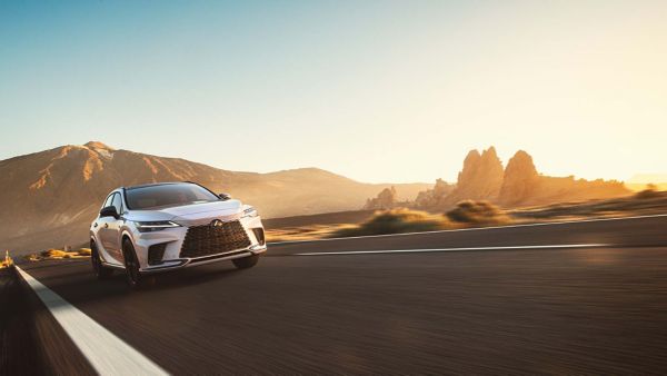 A Lexus RX driving on a road