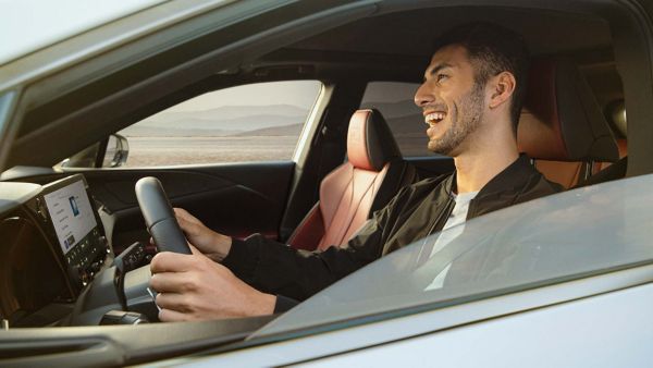 A man driving a Lexus RX