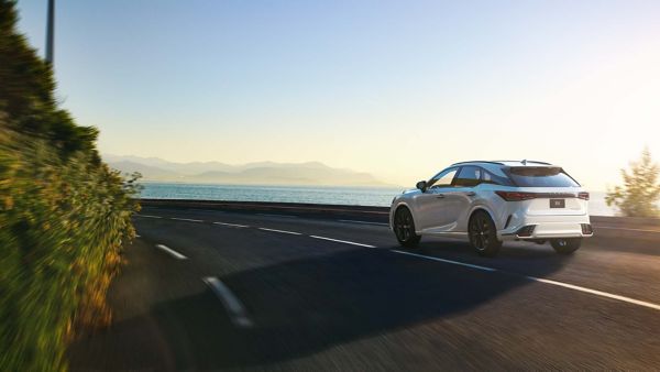 A Lexus RX driving on a coastal road