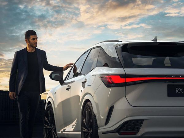 A man approaching a Lexus RX