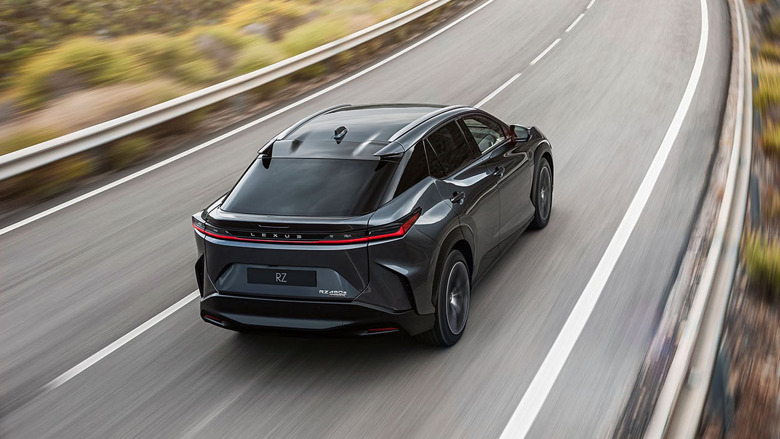 The Lexus RZ 450e driving on a road