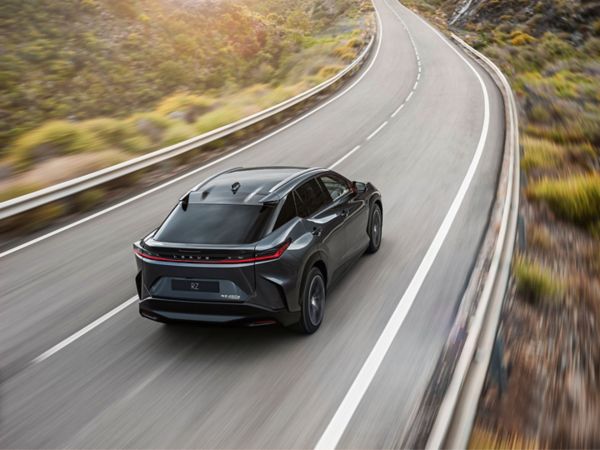 The Lexus RZ 450e driving on a road