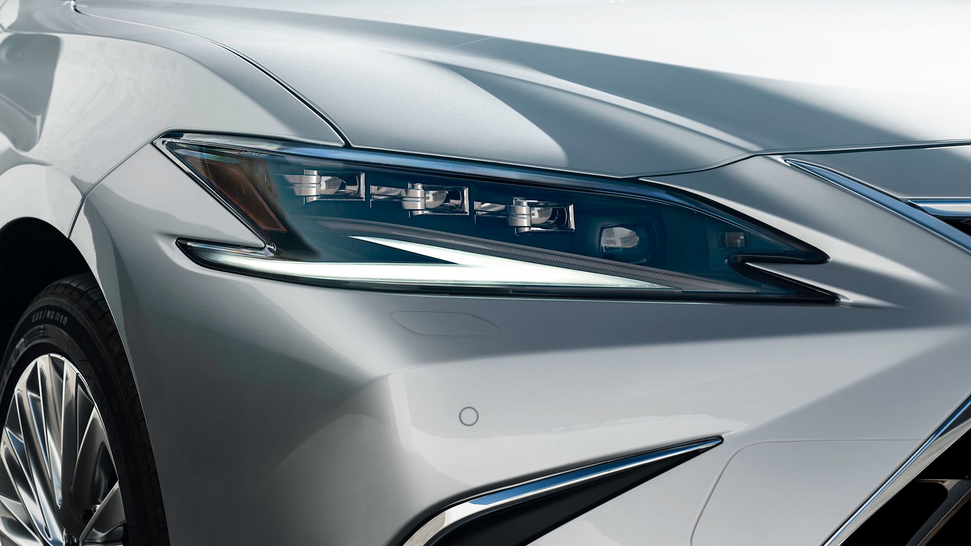 A Lexus ES driving on a road