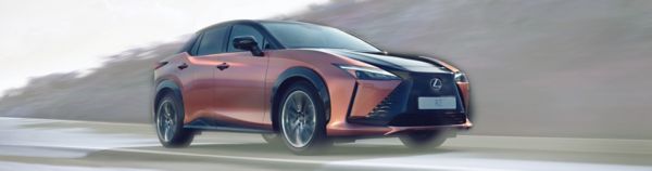 A Lexus RZ driving at speed