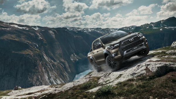 Toyota Hilux driving up a mountain