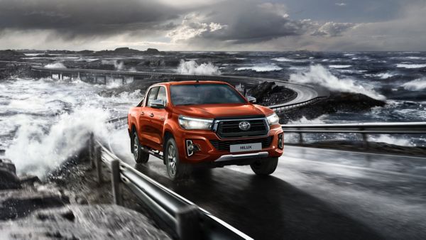 Toyota Hilux driving by the sea