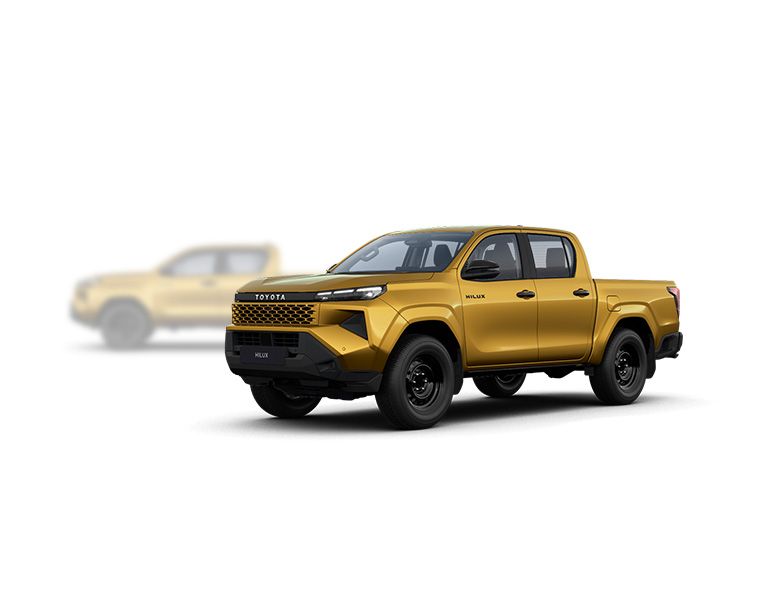 Grauer Toyota Hilux Mild-Hybrid steht diagonal zur Kamera, im Hintergrund ist unscharf ein gelber Hilux zu erkennen