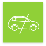 Ikona przekreślonego samochodu na zielonym tle.