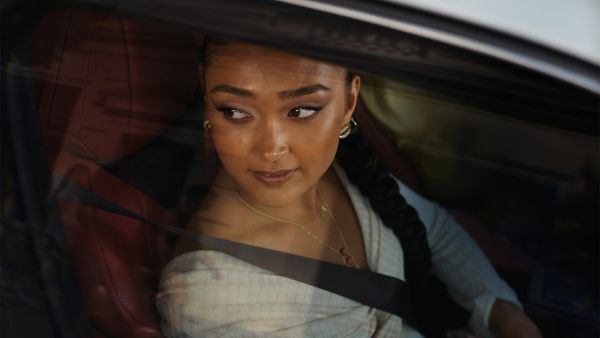 Joy Crookes sat in a Lexus UX