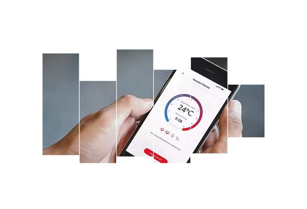 Smartphone in der Hand einer Person, darauf eine App zum Bedienen der Klimatisierung zu sehen.