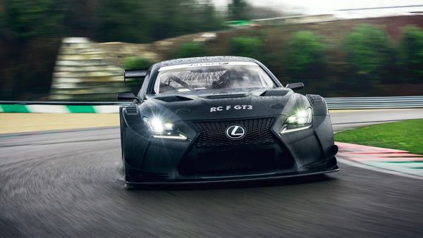 Lexus LC and LC Convertible parked in front of a racetrack 