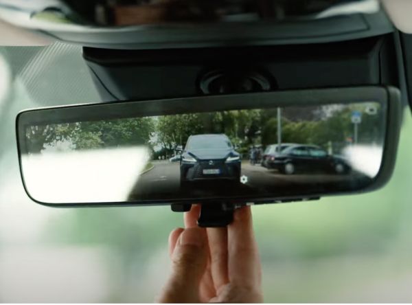 A Lexus seen through a rear view mirror