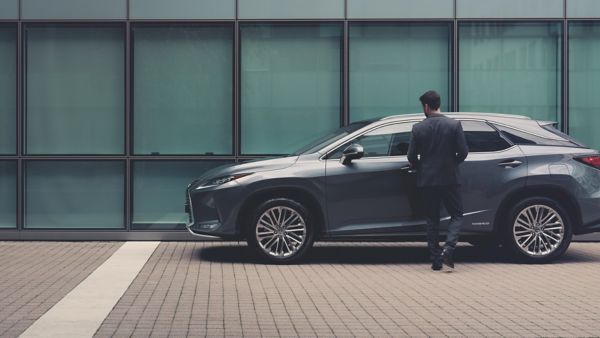 Man outside a Lexus NX