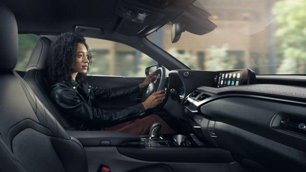 woman driving a Lexus car