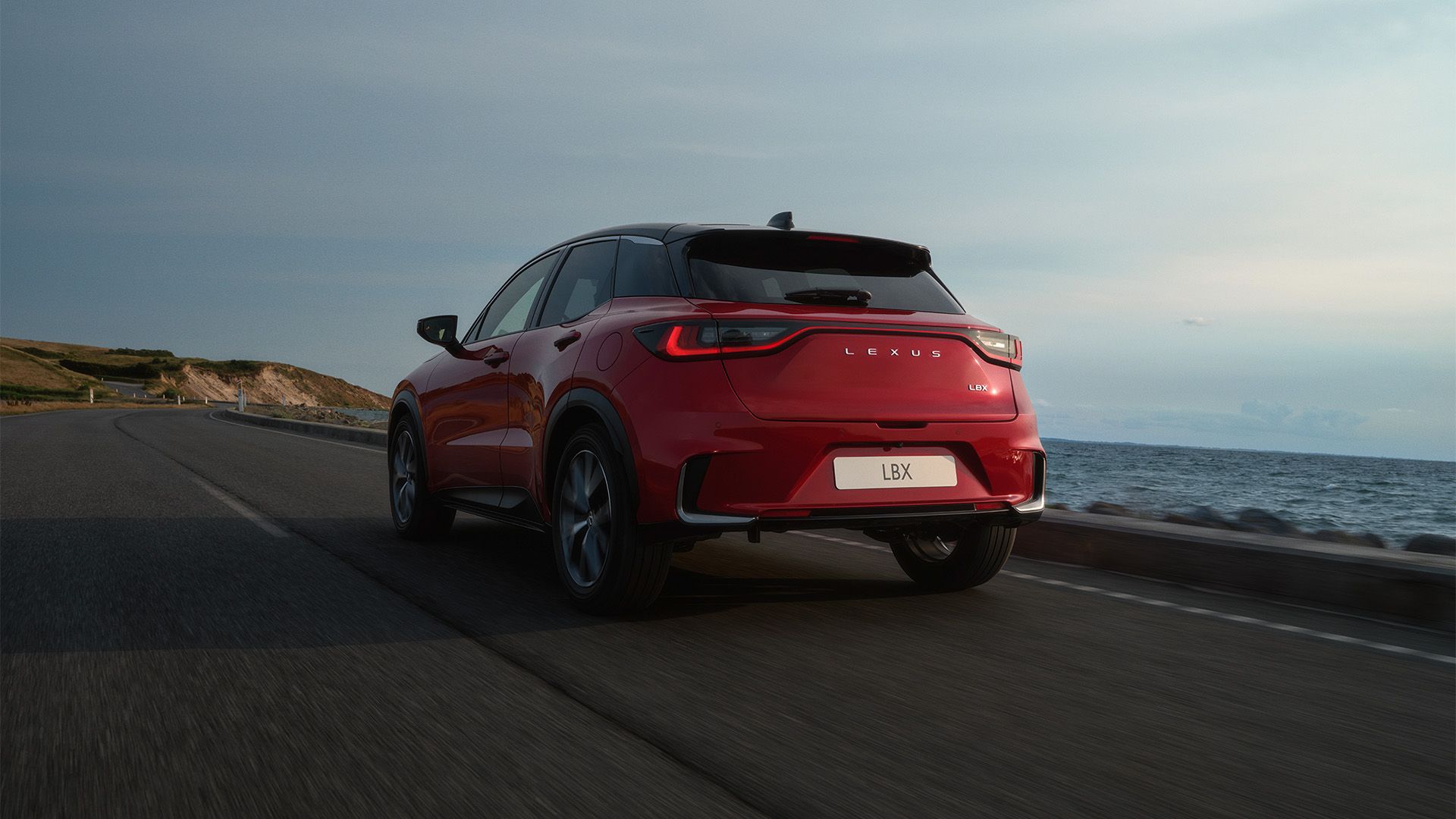 Rear three-quarter view of a parked Lexus UX 300h