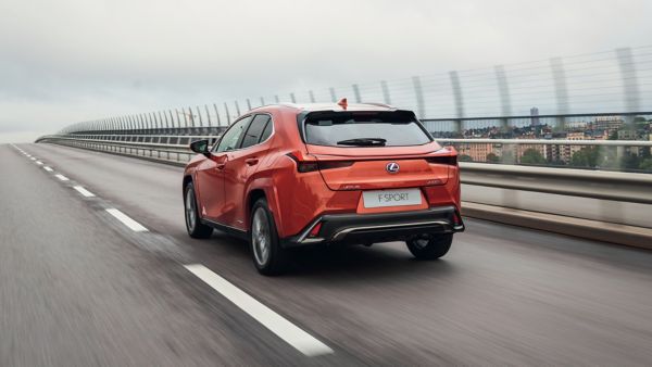 Lexus UX 250h driving down a road