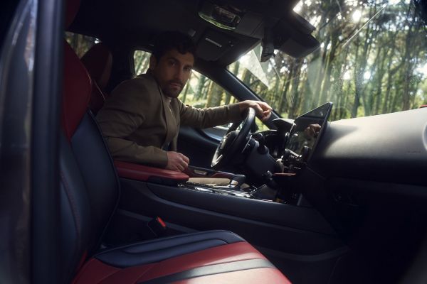 man looking out of his Lexus NX