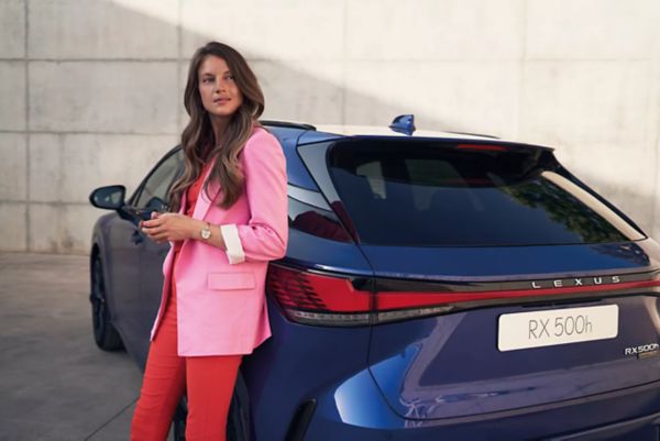 Woman standing next to Lexus RX 500h