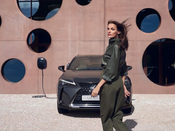 person pressing a button inside their Lexus UX 300e