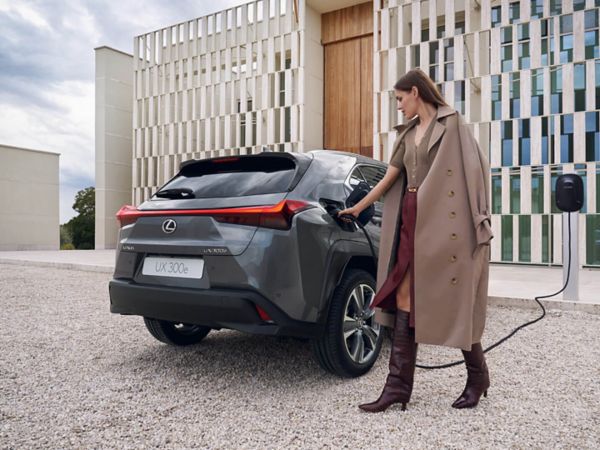 person pressing a button inside their Lexus UX 300e