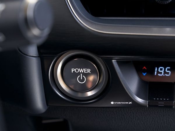 person pressing a button inside their Lexus UX 300e