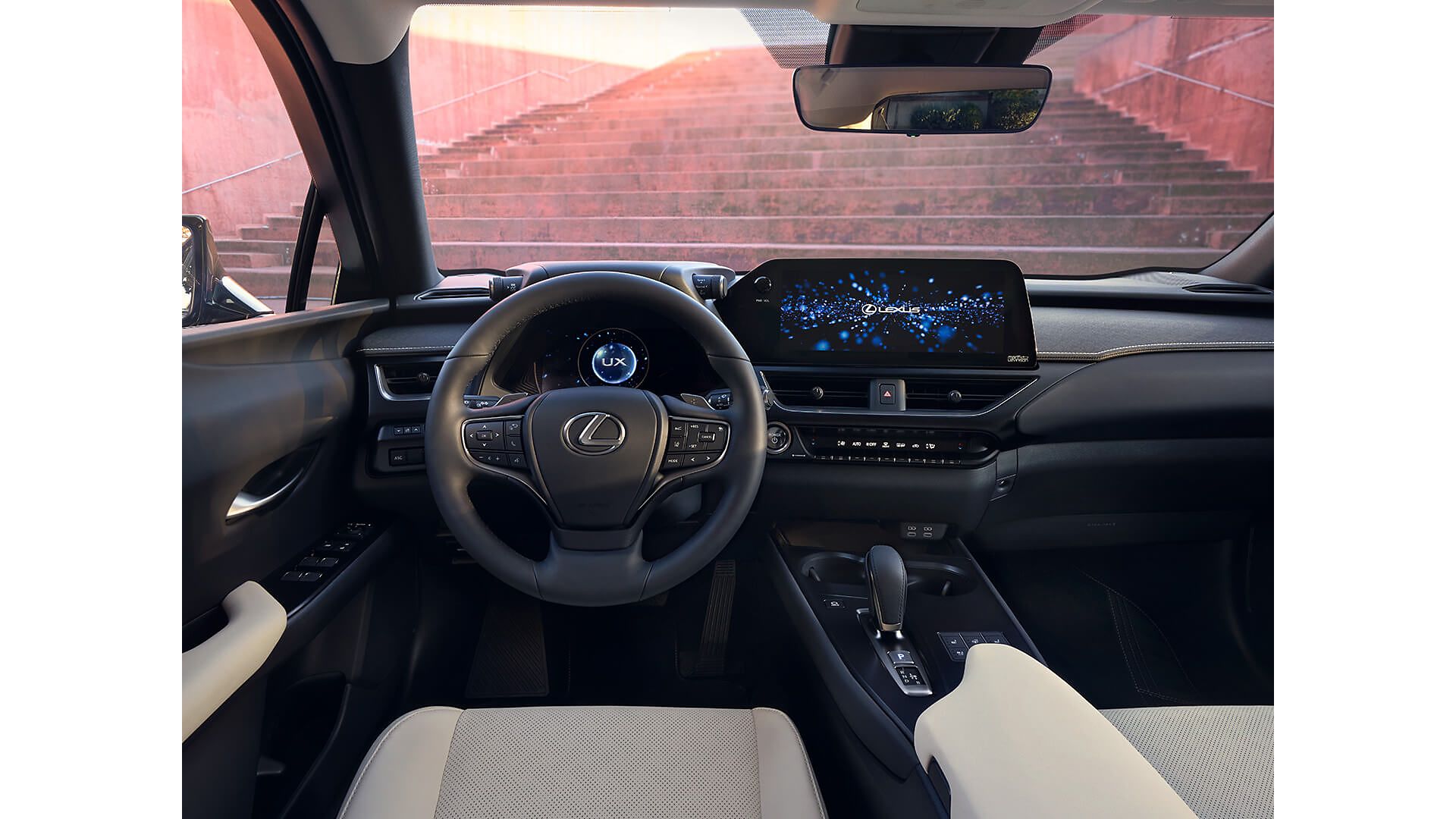 person pressing a button inside their Lexus UX 300e