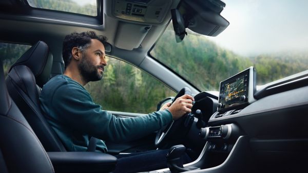 man driving Toyota RAV4