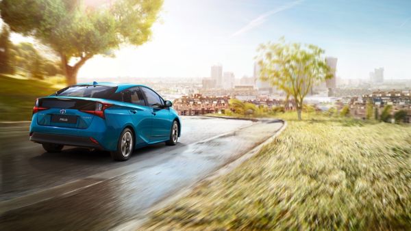 Toyota Prius driving along the road
