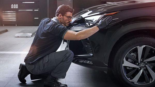 A hybrid Lexus in a garage 