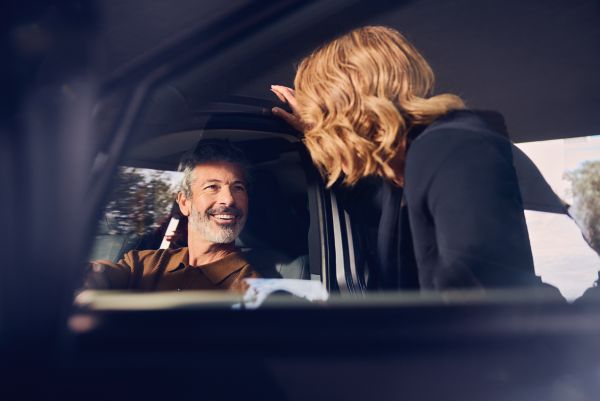 A Lexus representative smiling at customer