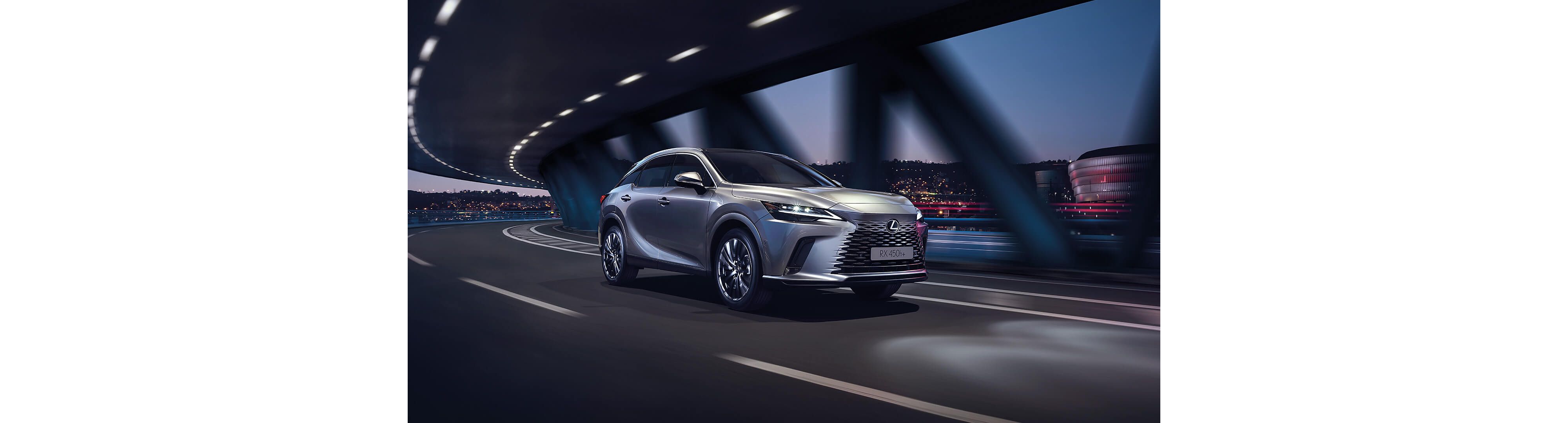 Lexus RX 450h+ driving at night