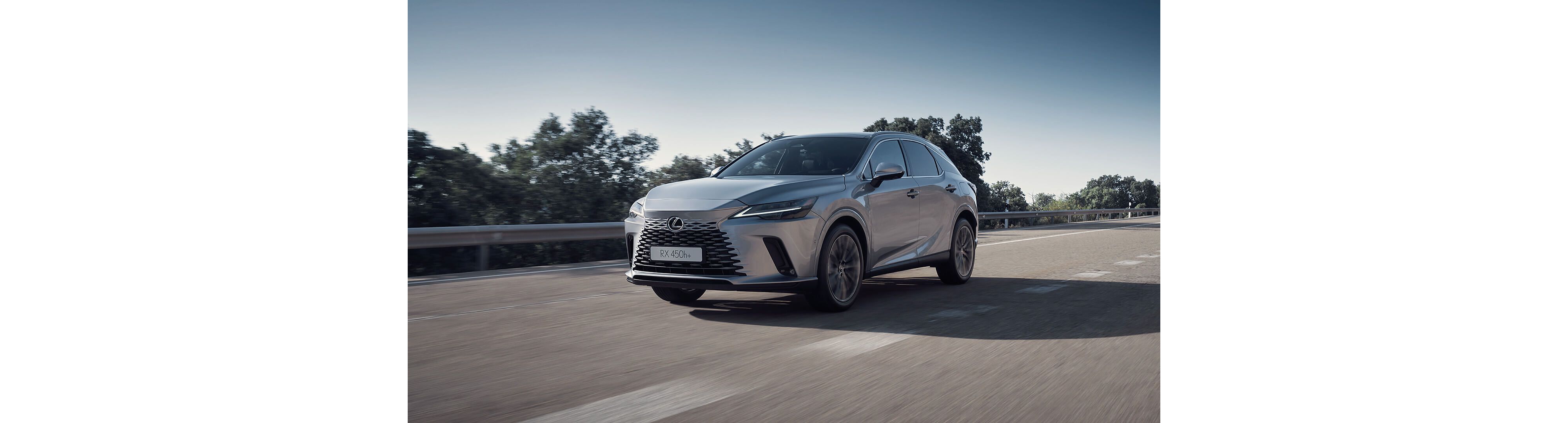 Lexus RX 450h+ driving on a road