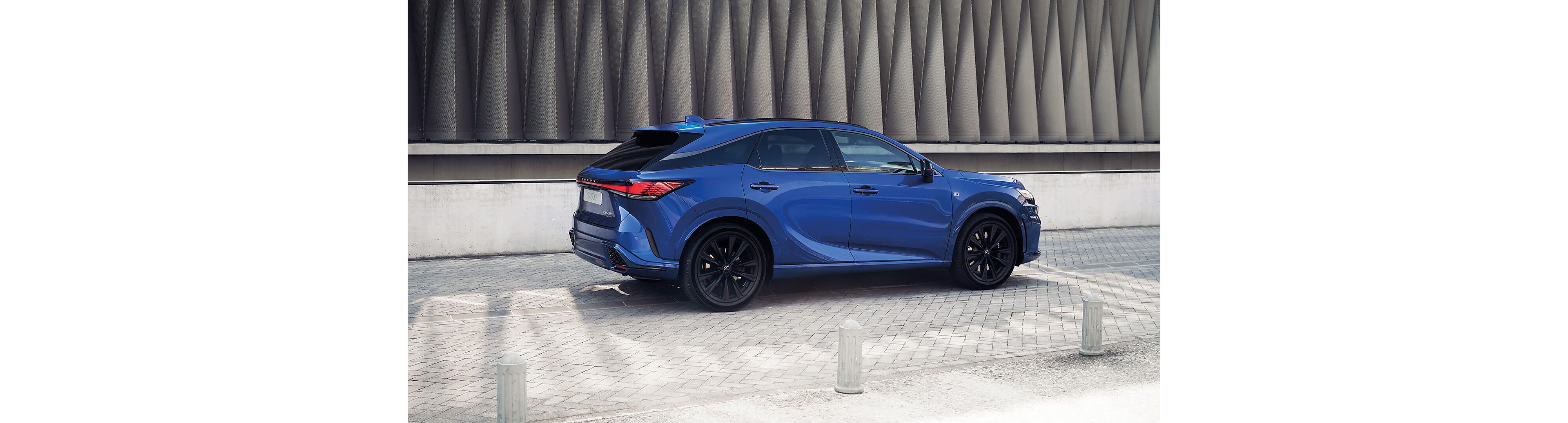Side view of a parked Lexus RX 500h