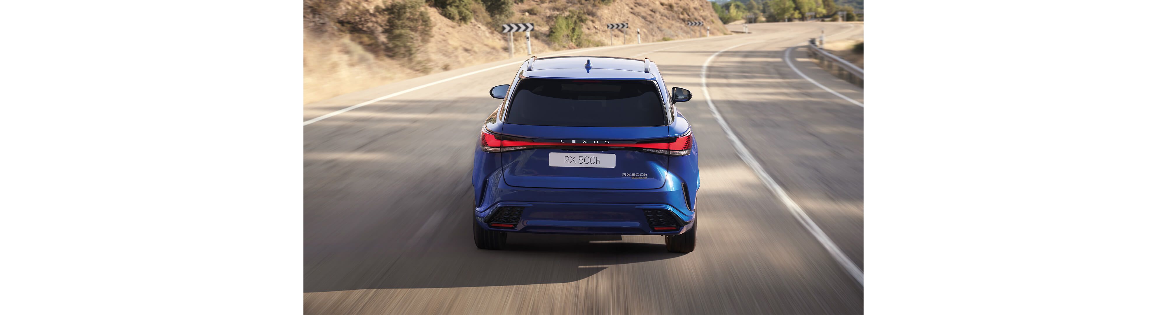Rear view of a Lexus RX 500h driving
