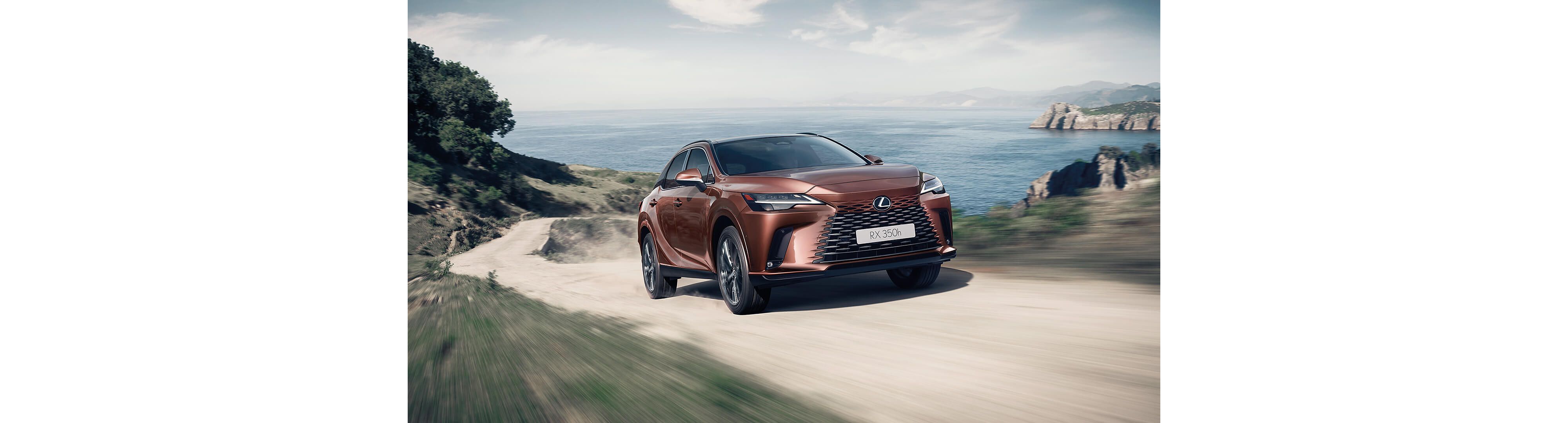 Lexus RX 350h driving up a coastal track