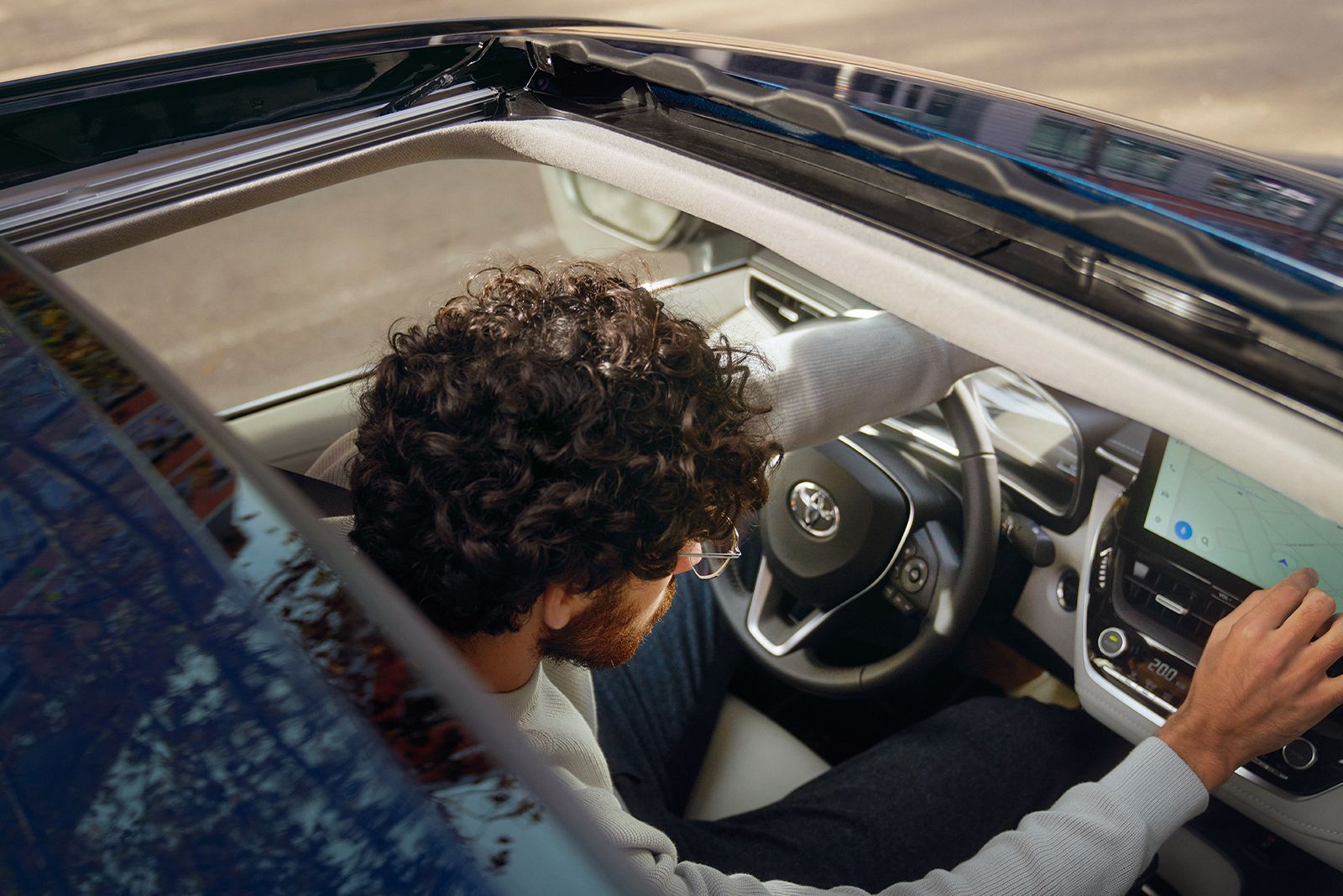 The Toyota Corolla Sedan’s steering wheel and multimedia touchscreen