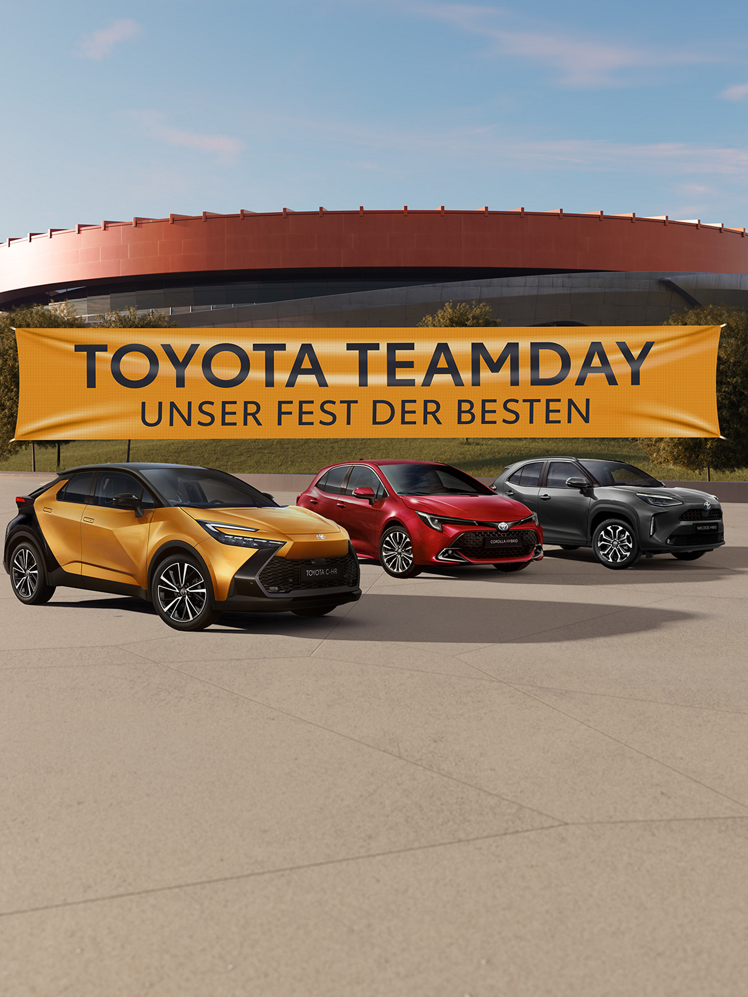 Toyota Modelle vor einem Stadion, an dem ein gelbes Banner mit der Aufschrift "Toyota Teamday - unser Fest der Besten" steht